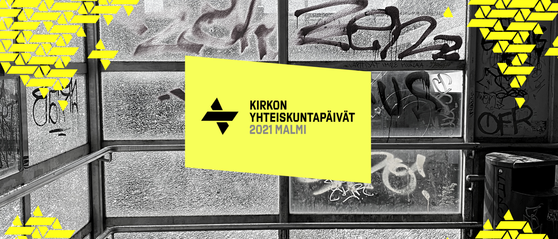 Graffitiseinän päällä keltainen neliö, jossa teksti: Kirkon yhteiskuntapäivät 2021 Malmi