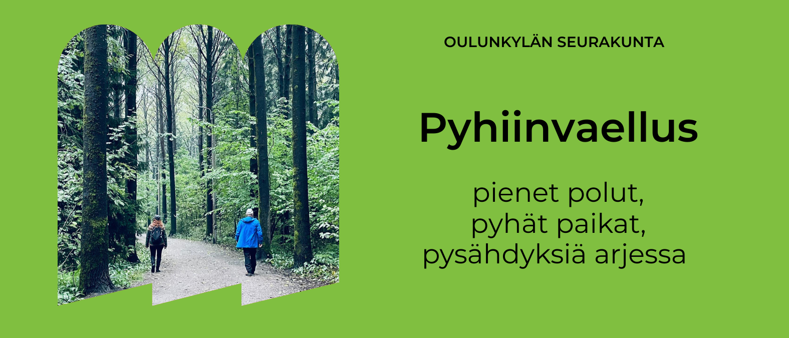 Kaksi ihmistä kävelee hiekkatiellä metsässä korkeiden puiden ympäröimänä