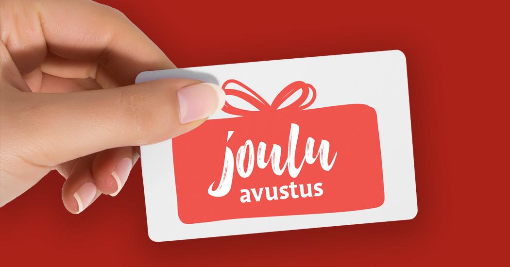 Punaista taustaa vasten käsi joka pitelee korttia, jossa on piirretty lahjapaketti ja teksti jouluavustus.