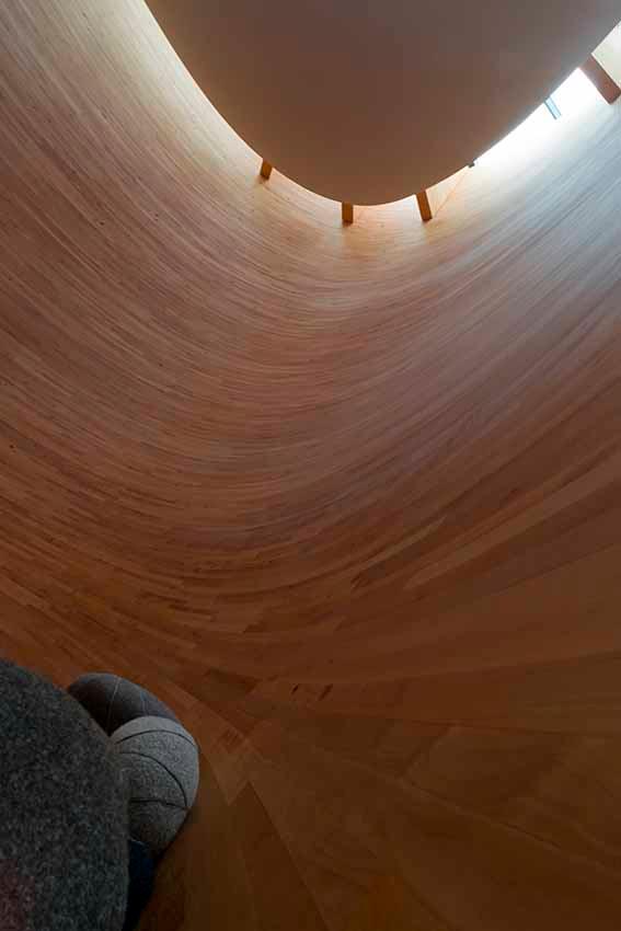 Kamppi chapel from the inside, stone pillows and a light from the ceiling